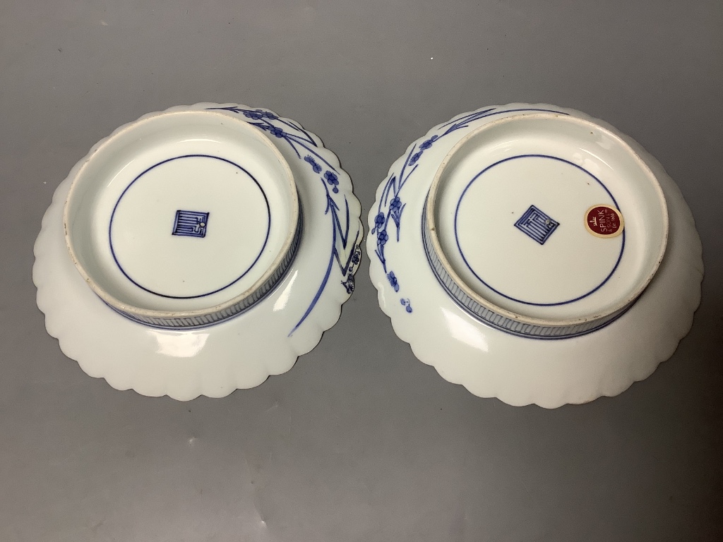 A pair of Japanese Kakiemon blue and white dishes, late 17th century, diameter 15cm, Spink & Son label